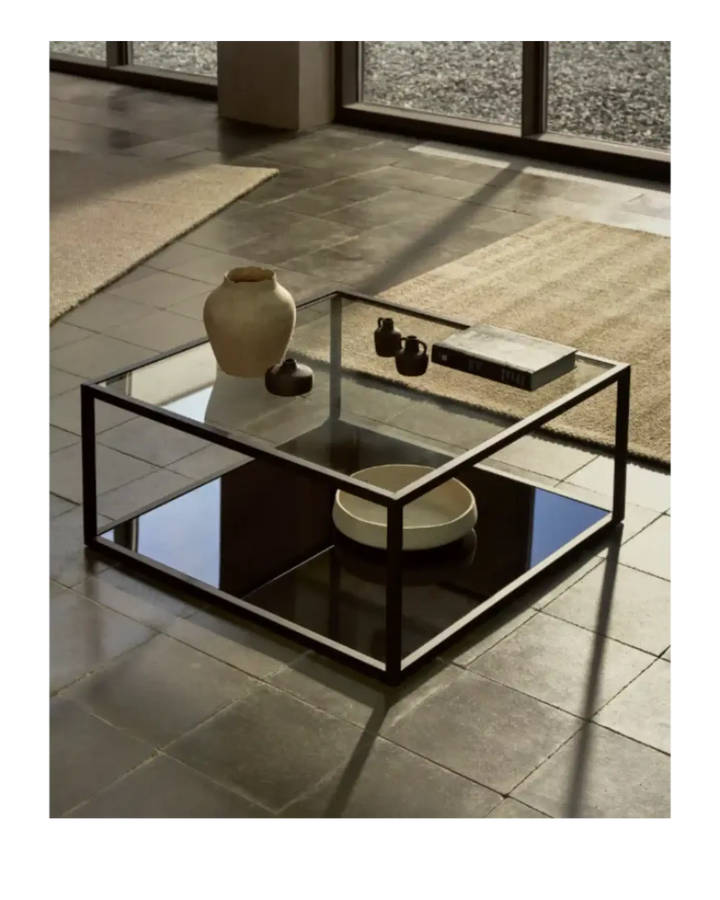 Black coffee table with a glass top