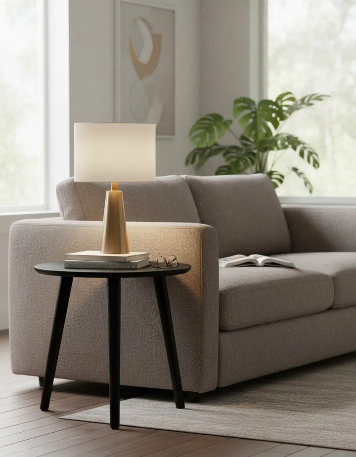 Indiga Furniture Doolin black round lamp table with three tapered legs, modern minimalist design.